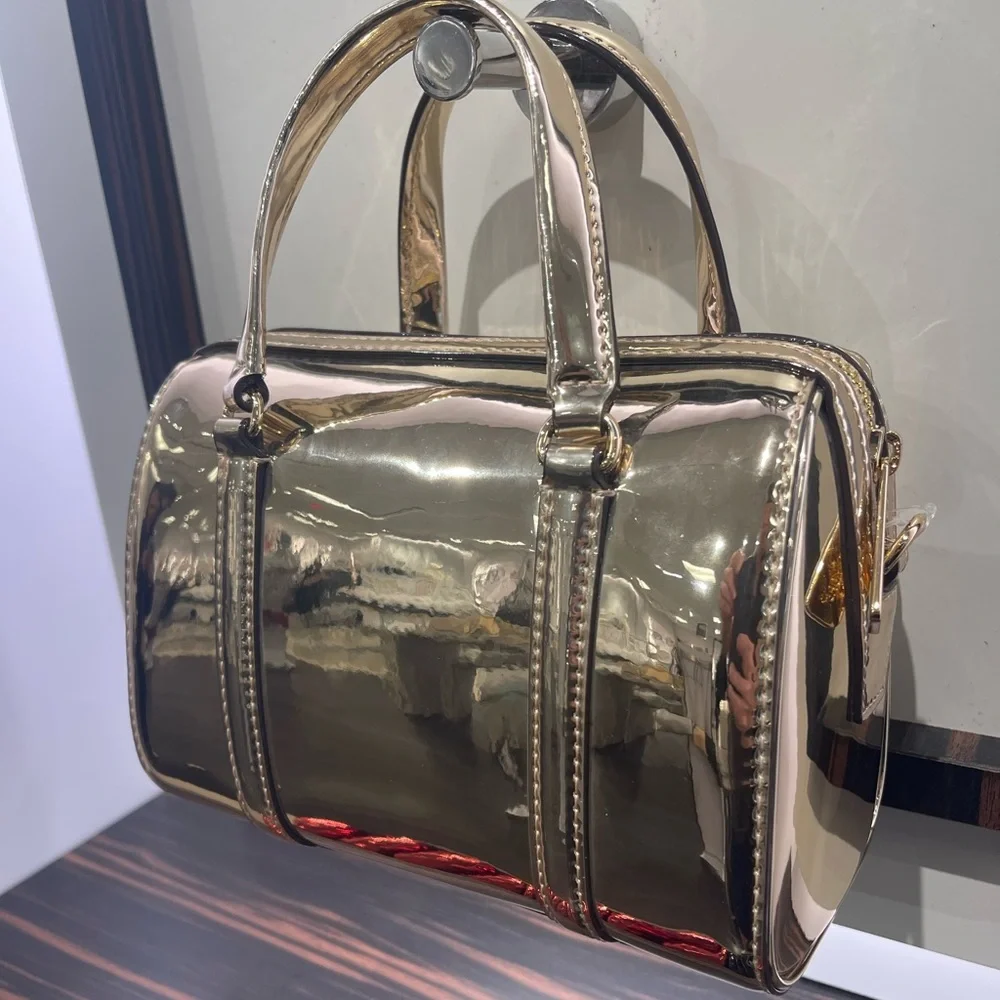 MICHAEL KORS Jet Set Small Metallic Convertible Crossbody Duffle Xbody
Pale Gold - Picture 16 of 16